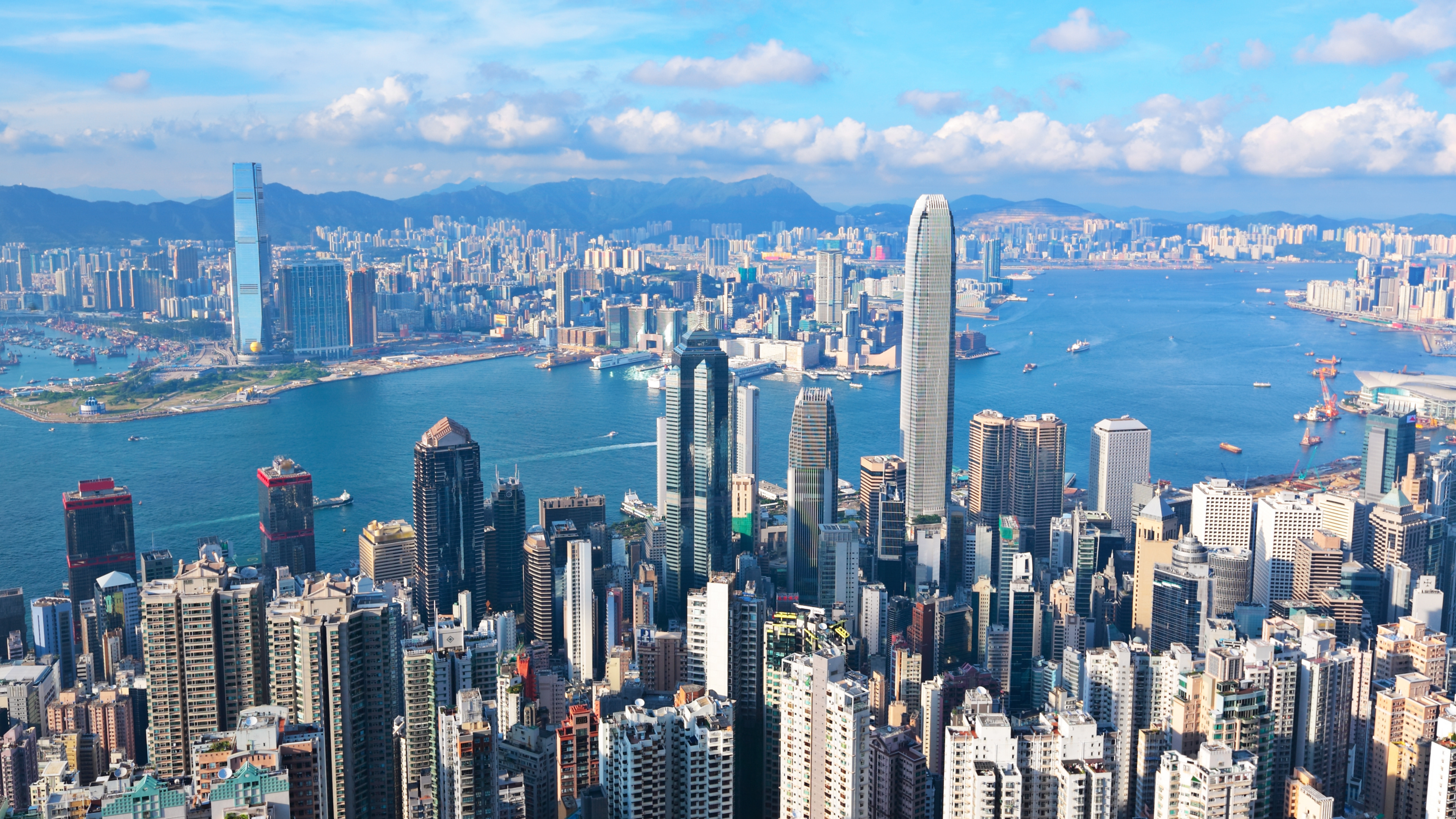Aerial view of Hong Kong's Victoria Harbour skyline with skyscrapers and waterfront — international conference destination